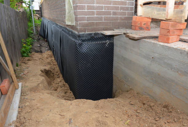 Happy homeowners after waterproofing job in Pratts